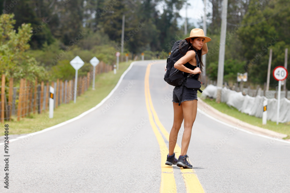 Young Backpacker woman on the road Young Backpacker woman on the road