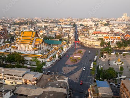 An aerial view of Red Giant Swing and Suthat Thepwararam Temple at sunrise scene  The most famous tourist attraction in Bangkok  Thailand.