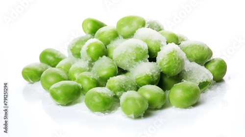 Frozen peas scattered on an isolated white background, focus on the ice crystals and bright green color