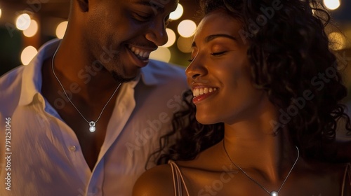 A couple wearing matching necklaces with small lights that pulse in sync with each other creating a sense of connection and improving their mood and wellbeing. .