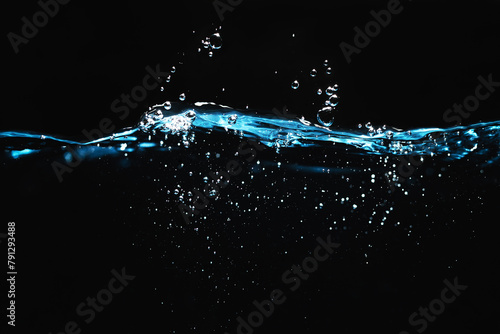Clear Water Surface Splashing on Black Background. Ripple and Bubbles, Water Wave.