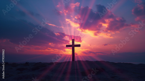 A cross is lit up by the sun in a beautiful sunset