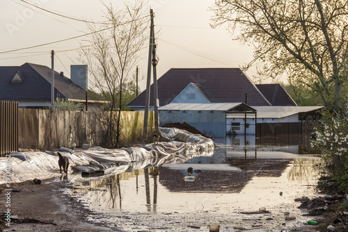 Flood in Kazakhstan. Strengthening from bags in a dacha cooperative. The river overflowed its banks. Water flooded the streets of residential areas. Cataclysms in Kazakhstan.