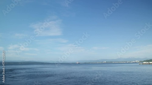 Panning shot of the Puget Sound in Washington on a clear sunny day. photo