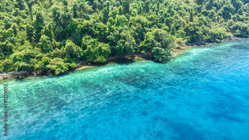 Aerial view of islands, Andaman Sea, natural blue waters and forests, tropical sea of Thailand. Beautiful scenery of the island with beautiful nature.