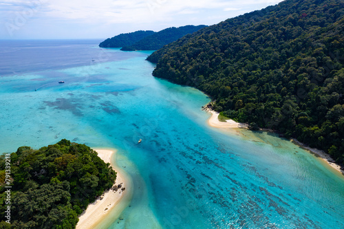 Aerial view of islands, Andaman Sea, natural blue waters and forests, tropical sea of Thailand. Beautiful scenery of the island with beautiful nature. 