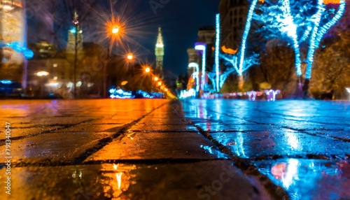 Streetlights Illuminate the Wet City Pavement