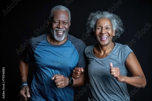 Happy African-American senior couple enjoying a joyful jog in the beautiful park