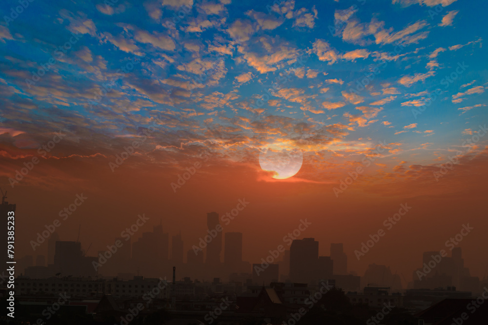 Sunset  with cityscape of building silhouette,At  twilight  in Bangkok ,Thailand