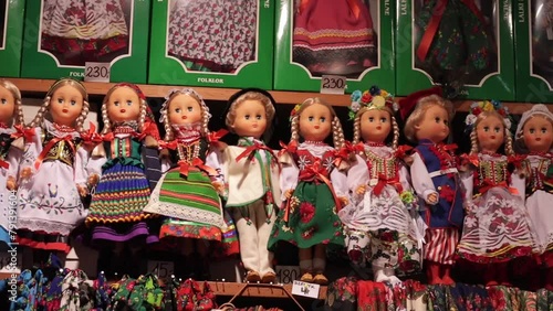 Souvenirs, and traditional dolls at the market in the Krakow Cloth Hall, Poland. photo