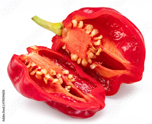 Sliced red habanero pepper with seeds isolated on white background.