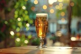 Glass of beer on a table in a restaurant with bokeh background