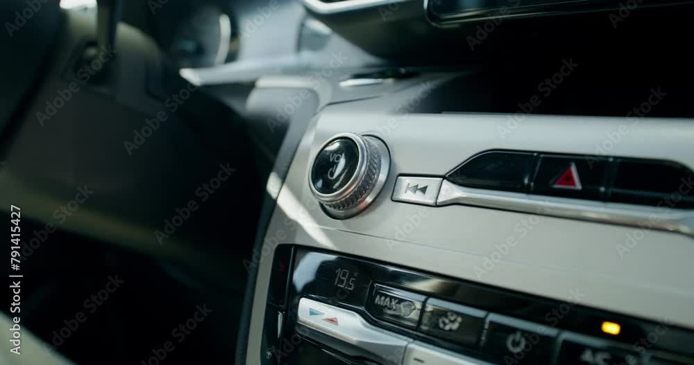 Close-up of the audio player in the car. The button for turning on and controlling the music volume. There are no people Close-up of the audio player in the car. The button for turning on and controlling the music volume. There are no people