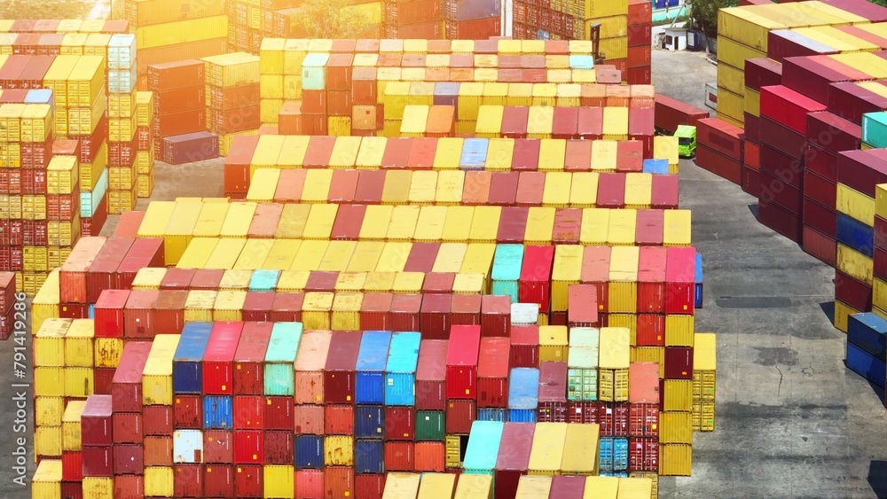 Behold a sprawling container yard, a vibrant mosaic of stacked containers against the horizon. Trucks bustle, cranes dance, orchestrating a symphony of logistics.
