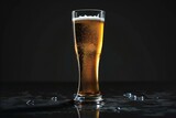 Glass of beer on a black background with water droplets and copy space