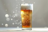Frosty glass of beer on a white background with bokeh