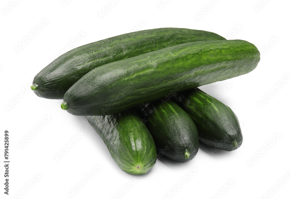 Many long fresh cucumbers isolated on white Many long fresh cucumbers isolated on white