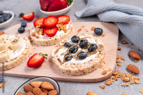 Rice Crackers Healthy Snack, Crackers Topped with Banana, Fresh Berries, Yogurt and Granola, Breakfast Idea