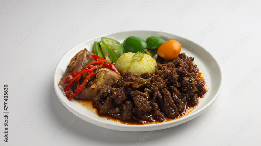 Beef Rendang or Nasi Rendang Sapi on white background