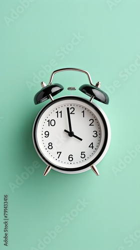 alarm clock on Mint Green background Minimalistic flat lay,with copy space for photo text or product, blank empty copyspace banner about time management and selfamplement concept. 