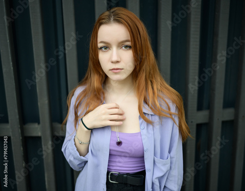 Beautiful girl with red hair is enjoying the summer days. © Vladimir Arndt