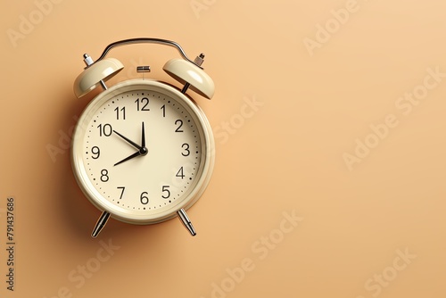 alarm clock on tan blue background Minimalistic flat lay,with copy space for photo text or product, blank empty copyspace banner about time management and selfamplement concept. 