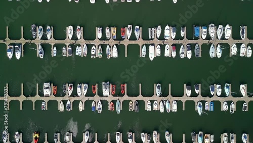 Overhead shot, beginning wide and pushing in to reveal boats on a marina on a sunny day.

Filmed at Bangor Marina, Northern Ireland in 4K, 60 frames per second and with Rec709 color space. photo