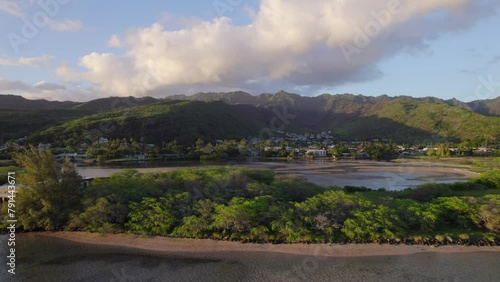 drone footage of the breathtaking landscape along the shore of Mamala Bay on the island of Oahu Hawaii with lush green mountains and sandy beach photo