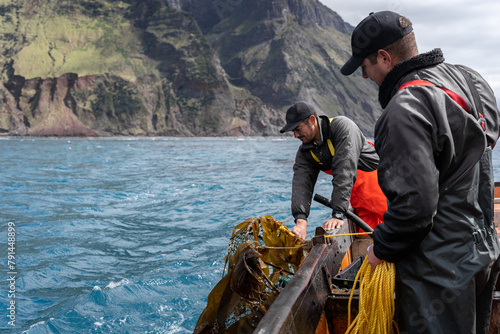 Принти на полотні Two fishermen collecting lobster fishing nets