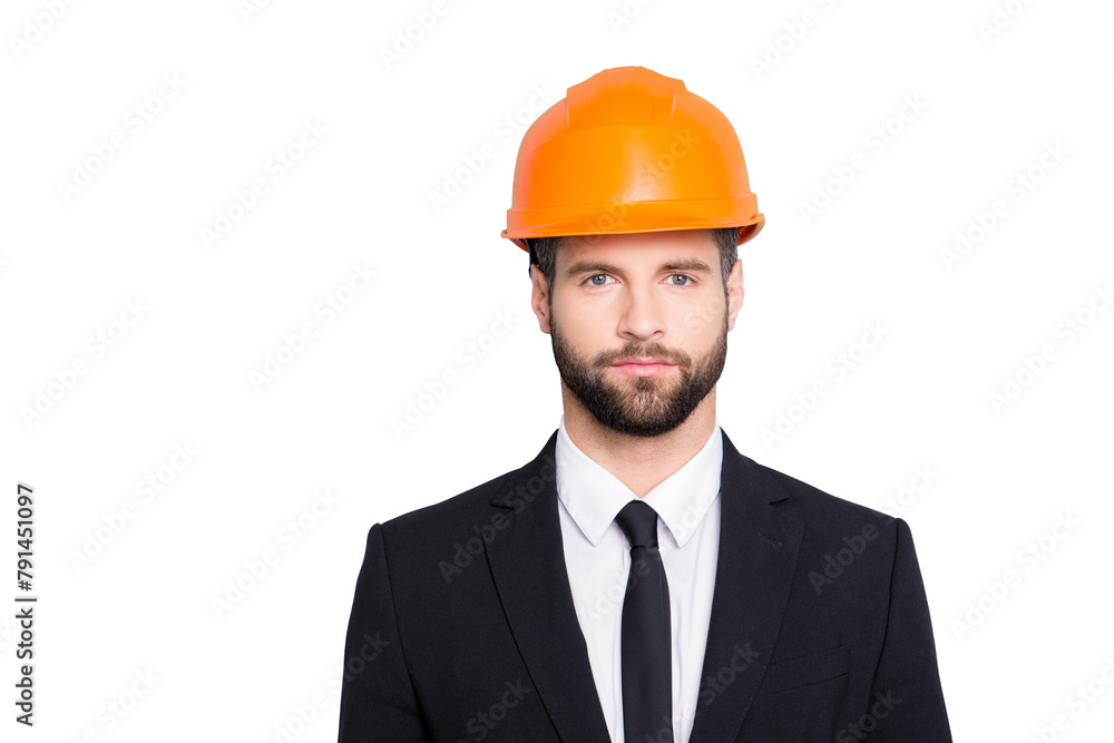 Portrait of concentrated, thoughtful architector with stubble in orange safety helmet, hardhat and black tux with tie, looking at camera, isolated on grey background Portrait of concentrated, thoughtful architector with stubble in orange safety helmet, hardhat and black tux with tie, looking at camera, isolated on grey background