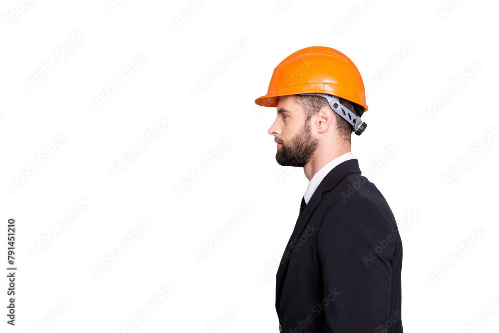 Profile side view half face portrait with copy space, empty place of  virile stylish investor with stubble in orange safety helmet, hardhat and black tux with tie, isolated on grey background
