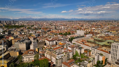 Milan cityscape against a background of blue sky, view from above in sunny weather