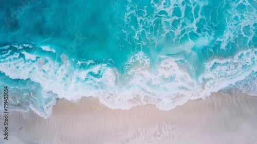 Beautiful beach with turquoise water and waves from above, top view