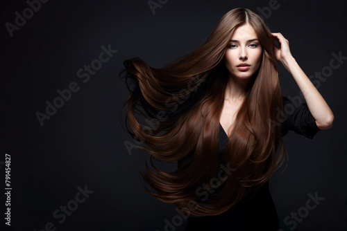 Elegant woman with luxurious long brown hair posing in a haircare beauty concept.