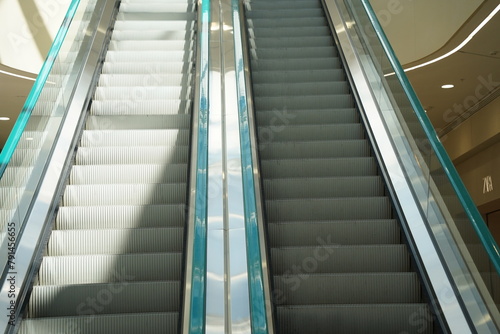 An escalator in a large shopping mall.
