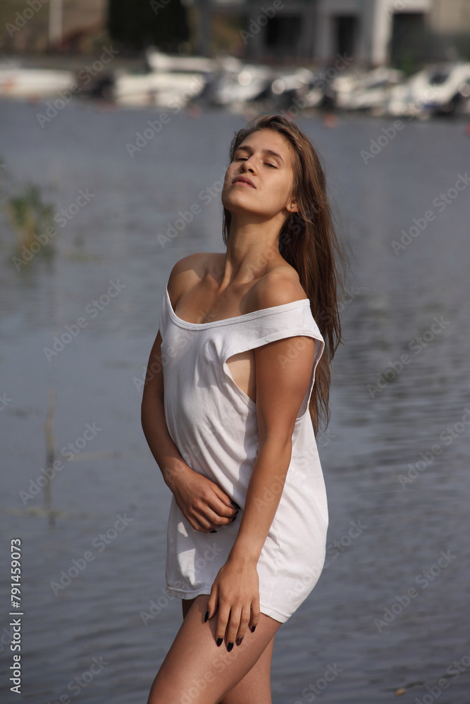 young woman in white shirt on the river young woman in white shirt on the river