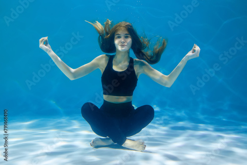 Wallpaper Mural Woman doing exercise underwater Torontodigital.ca