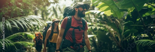 A group of adventurous hikers with backpacks trek through a dense jungle, exploring and discovering the lush environment photo