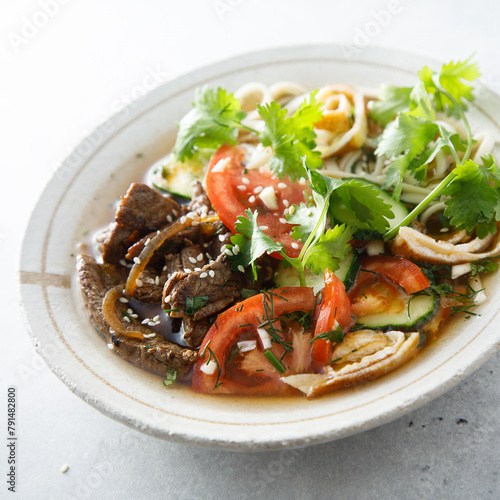 Traditional Korean soup with noodles and beef