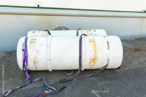 two freon gas cylinders are located outside on the harbor quay photo