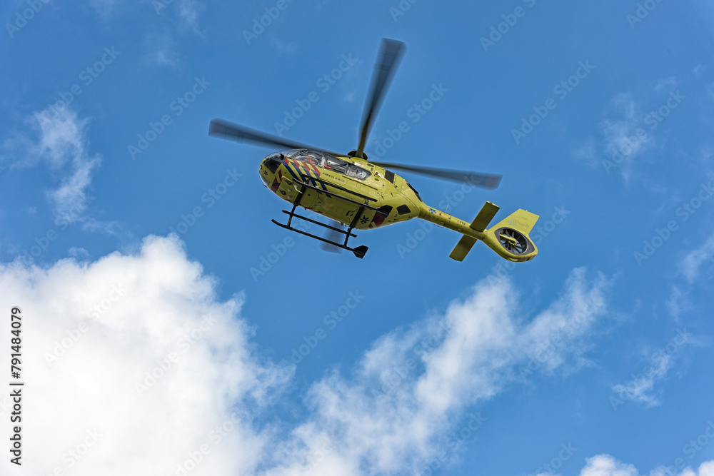 yellow ambulance helicopter flies high in the sky yellow ambulance helicopter flies high in the sky