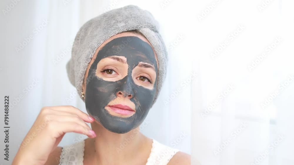 Woman with a cleansing face mask. Woman with a cleansing face mask.