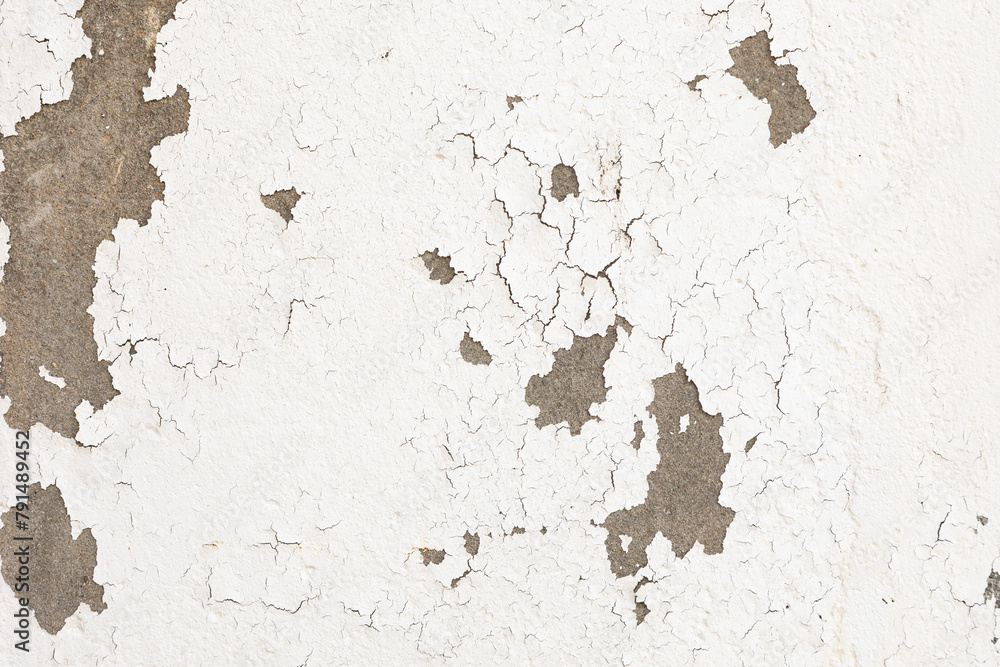 Obraz premium Showcasing the texture of a weathered wall with layers of peeling paint that reveal the passage of time and neglect