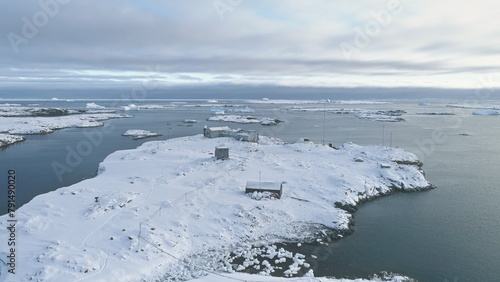 Vernadsky Base - South Polar Antarctic Station Aerial View. Ocean Coast Open Water Surface. South Pole Settlement Base Landscape Drone Flight