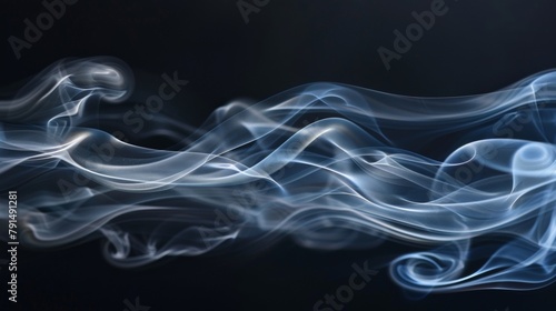 Elegant blue smoke swirls smoothly on a dark background in a flowing, artistic motion