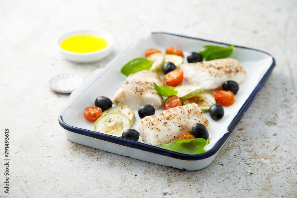 Roasted cod with olives, tomato and zucchini Roasted cod with olives, tomato and zucchini
