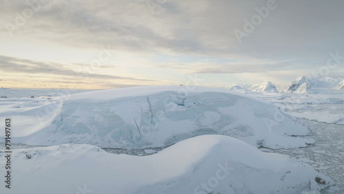 Antarctica Snow Hill Aerial Drone View. Climate Change. Antarctic Continent Expedition at Ocean Coastline. Polar Landscape. Global Warming and Melting Ice Concept. Top Flight