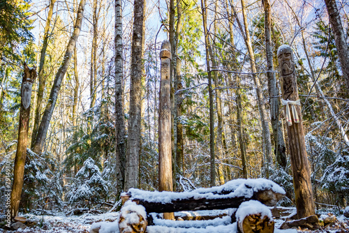 Slavic pagan idols on the forest temple. Veles, Makosh and Perun photo