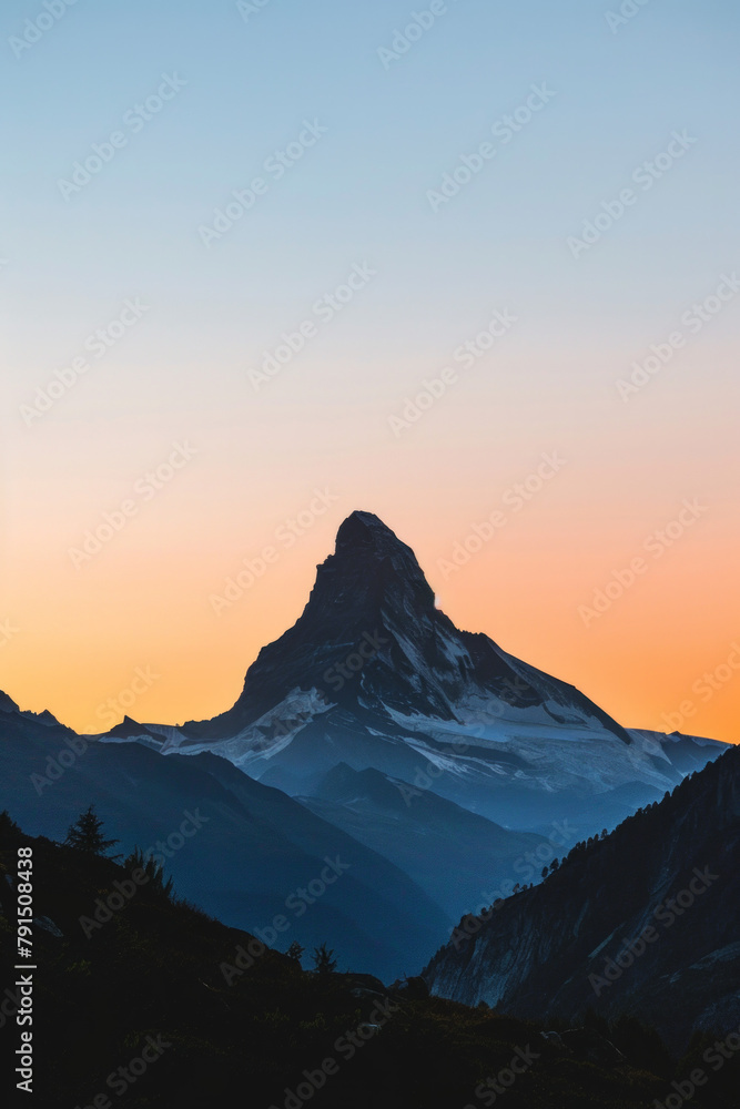 Silhouette of a single mountain peak against a clear sky during sunrise or sunset, with clean lines and negative space emphasizing the majesty of the natural landscape. 
