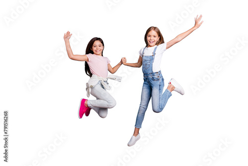 Full length body size view of two people nice-looking crazy cute lovely attractive cheerful careless straight-haired pre-teen girls having fun great day overjoy isolated over blue pastel background